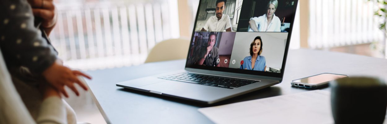 Businesspeople having a video call. Woman at home using a laptop to connect with her colleagues to discussing work.